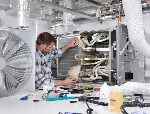 Southborough Air Duct Cleaning specialist performing precision AC coil cleaning in Southborough