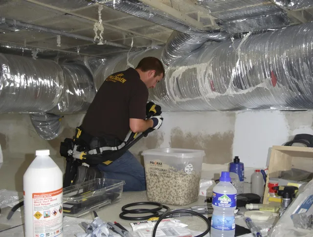 Southborough Air Duct Cleaning specialist performing professional mold removal from air ducts in Southborough