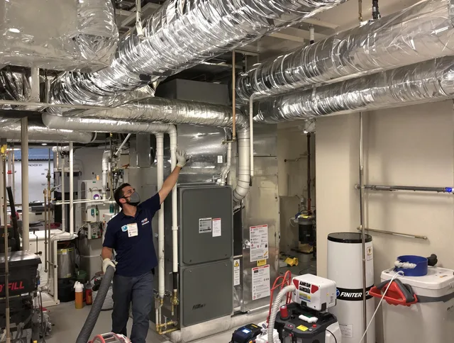 Southborough Air Duct Cleaning specialist performing thorough furnace duct cleaning in a Southborough residence
