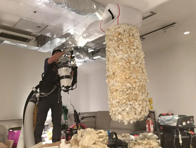 Southborough Air Duct Cleaning technician performing precision vacuum insulation removal in a residential property in Southborough
